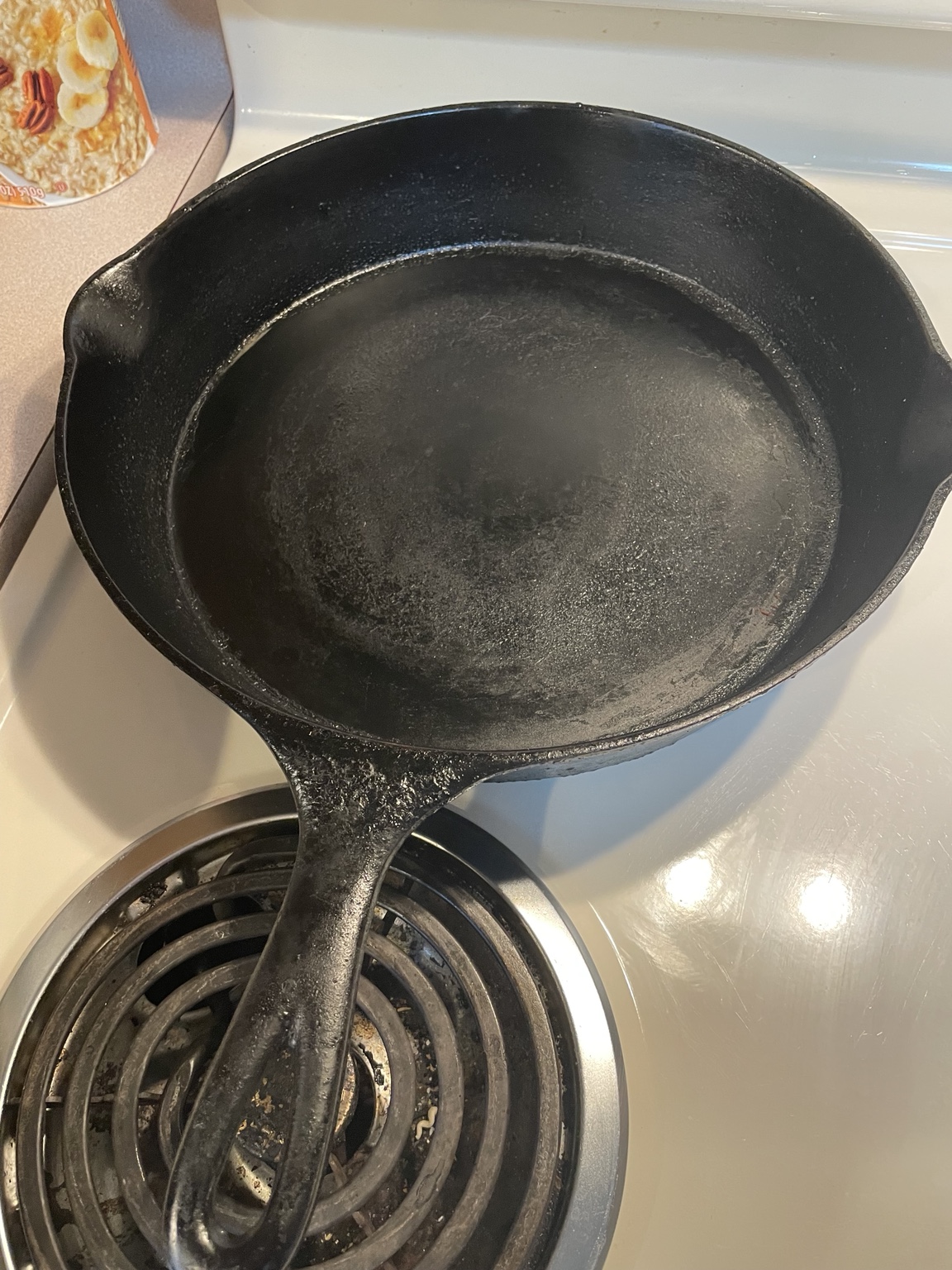 A seasoned Wagner cast-iron skillet on the stove